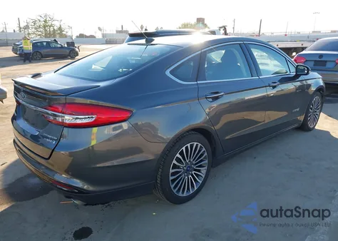 2018 Ford Fusion Hybrid Titanium z USA, uszkodzony, nr VIN 3FA6P0RU0JR181734